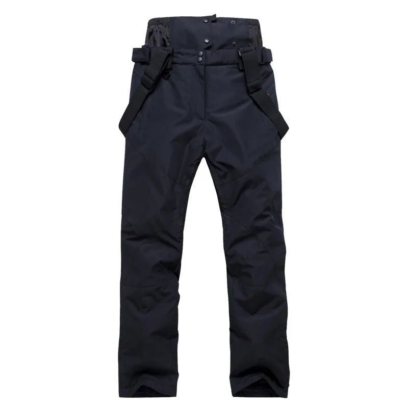Highline Women's Suspender Snow Pant in Black, front view, laid flat with the suspenders showing
