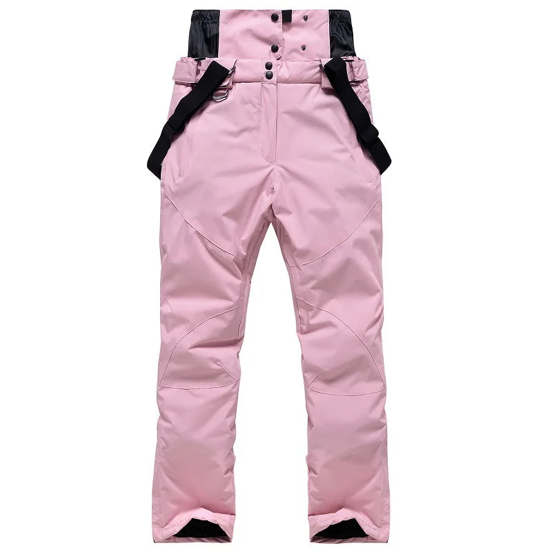 Highline Women's Suspender Snow Pant in Light Pink with black suspenders, front view, laid flat