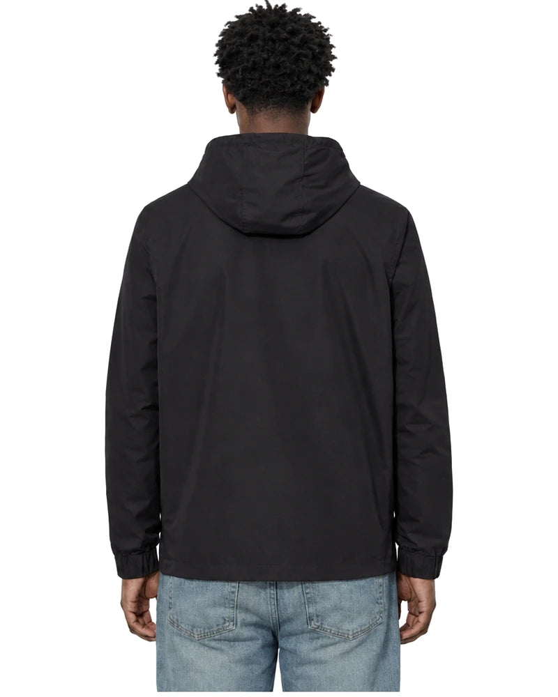 Rewind Water-Resistant Anorak in Blackout, worn by a model, back view with the hood down