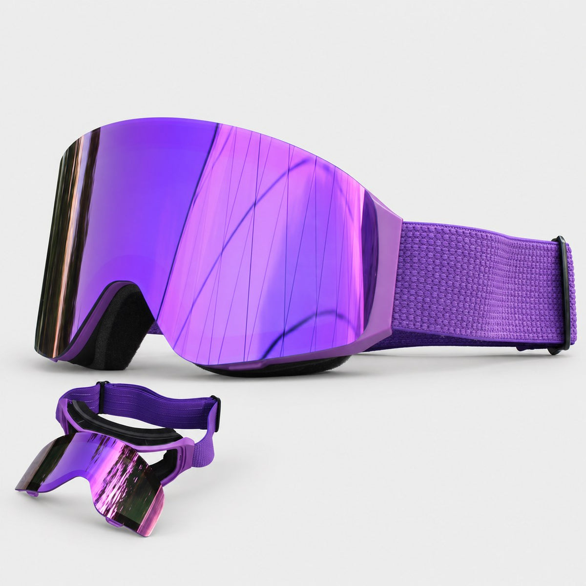 Purple snow goggle with purple strap, next to a second goggle with its magnetic outer lens flipped open