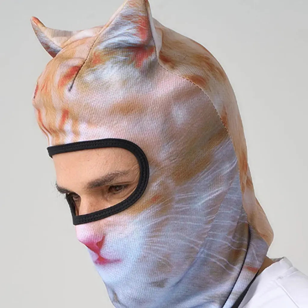Man wearing the ginger cat balaclava, side view